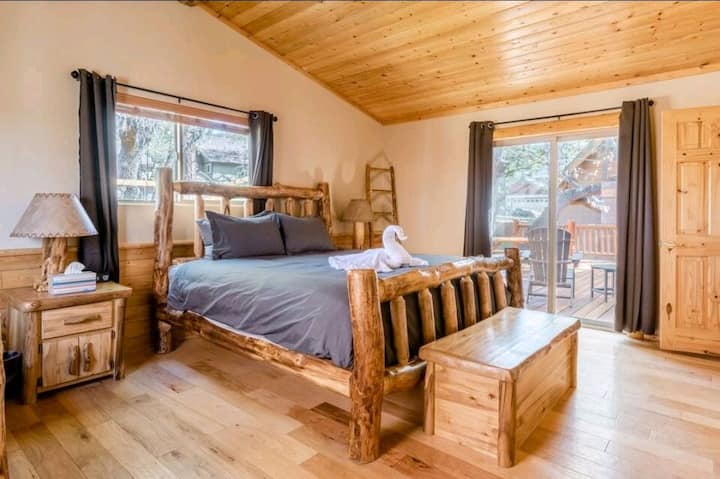 Master bedroom with private sliding doors to back wood-deck patio.