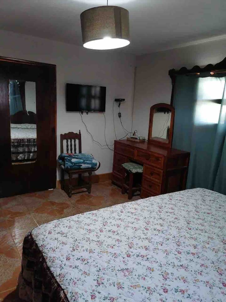 Master bedroom, closet, cable TV and king size bed