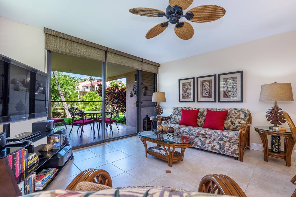 Living Room Area With Large Flat Screen TV And Pullout Sleeper Sofa