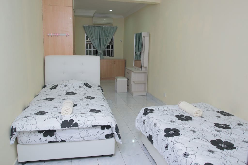 Bedroom with 2 twin beds and shared bathroom
