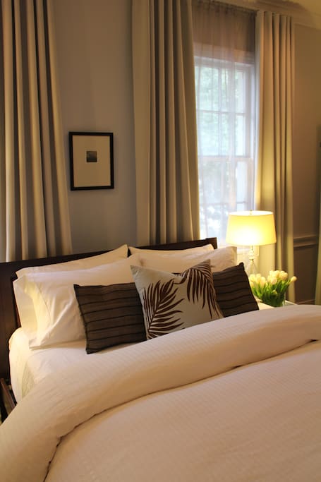 Bedroom features 600 threadcount linens and designer styling