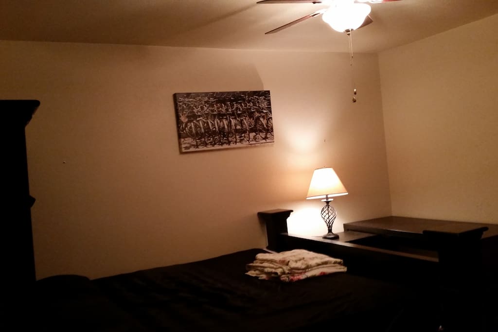 Bed, table and lamp