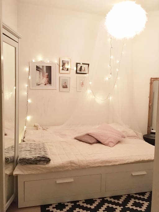 The bedroom with doublebed and the window view to the peaceful courtyard.