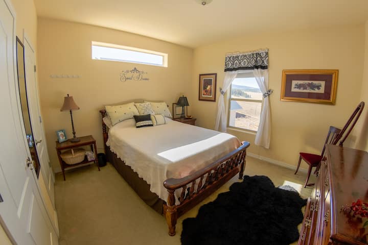 Main level bedroom. 1 queen with view of Mt Prinston.  Tempur-Pedic mattress. 