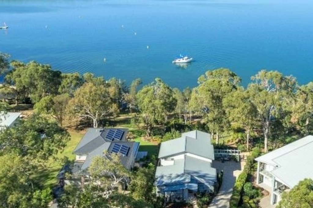 A bird's eye view of your waterfront self-contained unit and gardens