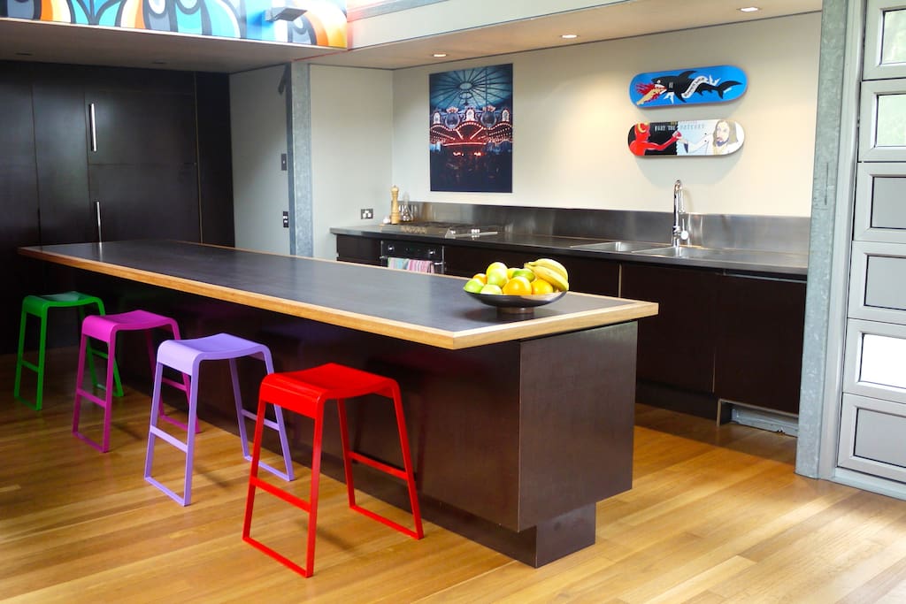 huge stainless kitchen with island bench