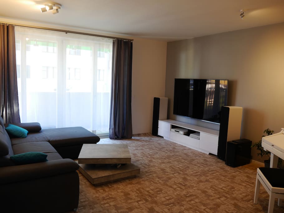 The living room with big TV, Big Hi-fi, Big piano, Big PS4... just big and ready for you :-)