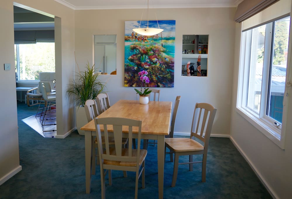 Dining room which flows onto the second living area and kitchen, and out onto the deck.