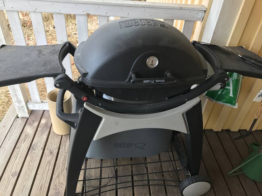A Weber gas grill on the terrace.