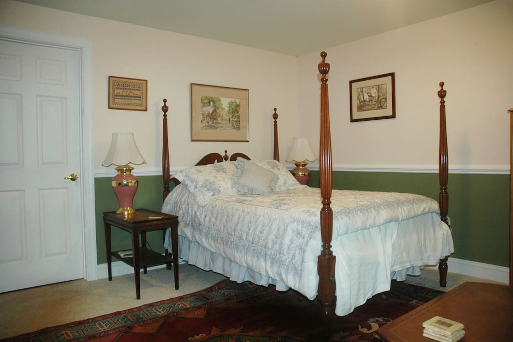 Bed with Laura Ashley linens.