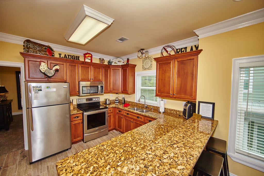 This is one of the 3 Kitchens which come stocked with everything you need & stainless steel appliances.
