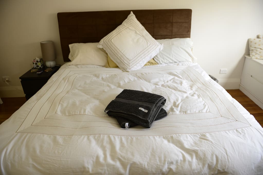 A super comfortable king-sized bed with Sheridan sheets and deliciously comfy pillows.