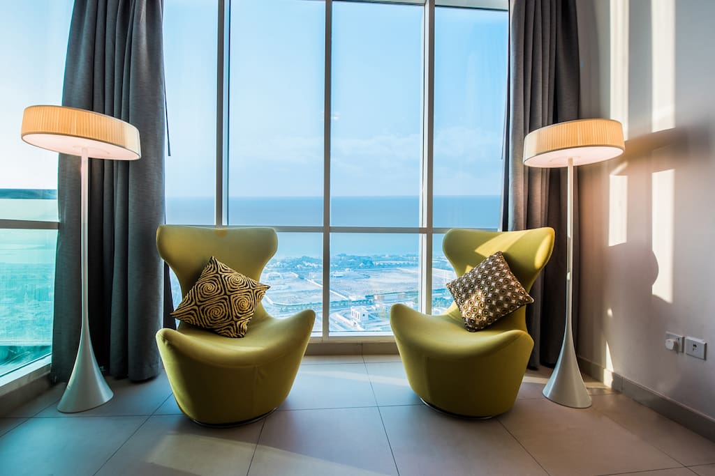 Comfortable arm chairs overlooking Al sufouh area, Palm Jumeirah, King's Palaces and beach.