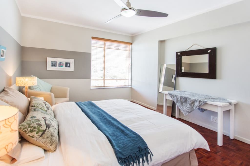 Large bedroom with queen size bed and also with a view of Table Mountain.
