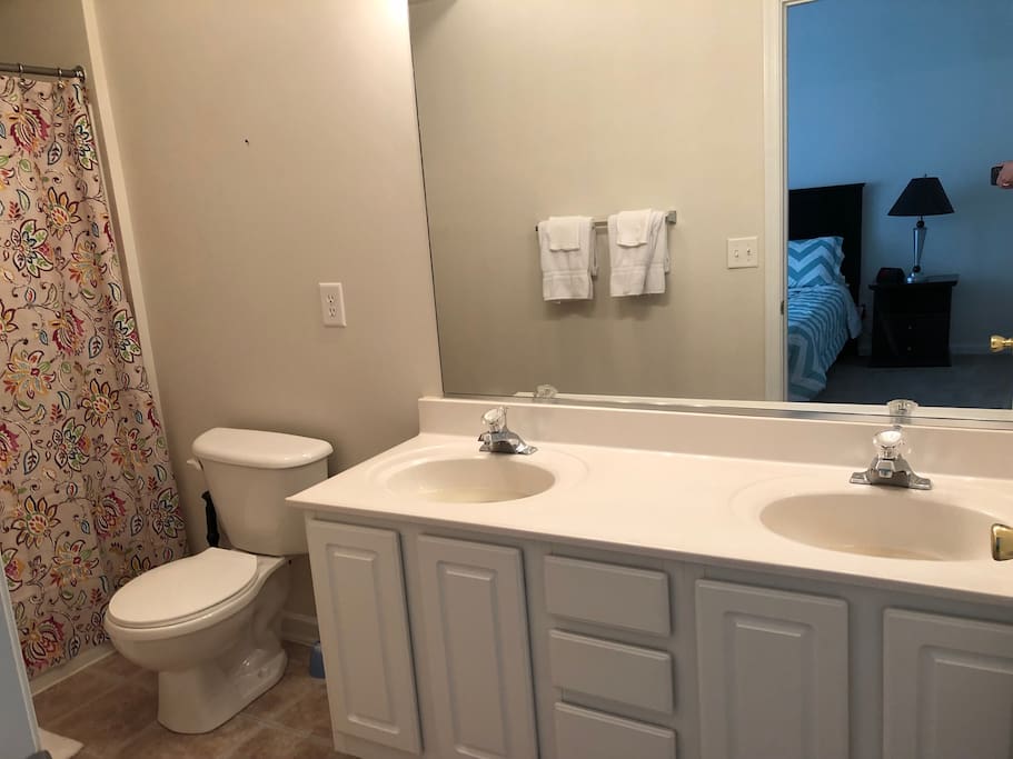 full bath with two sinks
