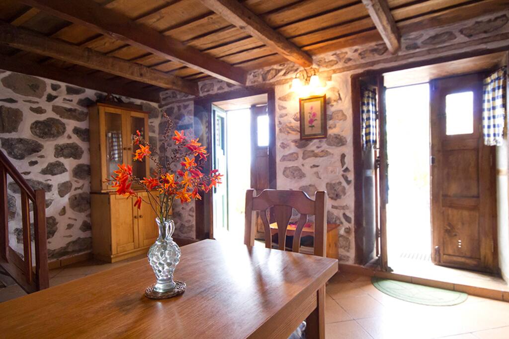 Dining table of lounge area. The two sets of doors open out onto patios