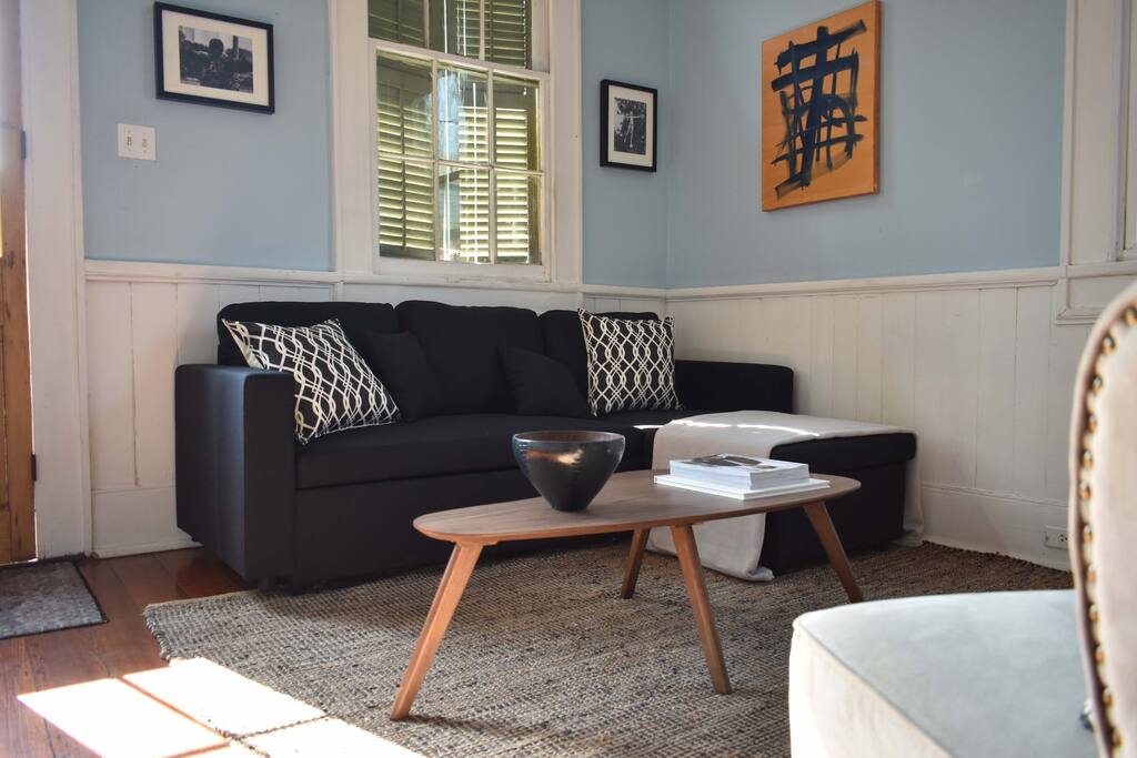 Bright and airy living room with sleeper sofa, smart TV and Wifi.