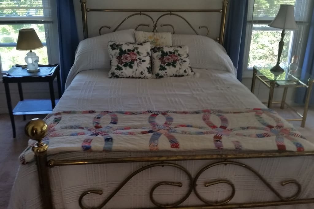 A large, sunny bedroom overlooking the lake is the perfect place to reconnect with yourself or have a cozy retreat together.