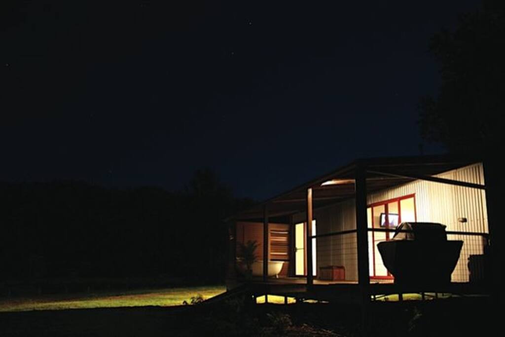 Creekside cabin by night