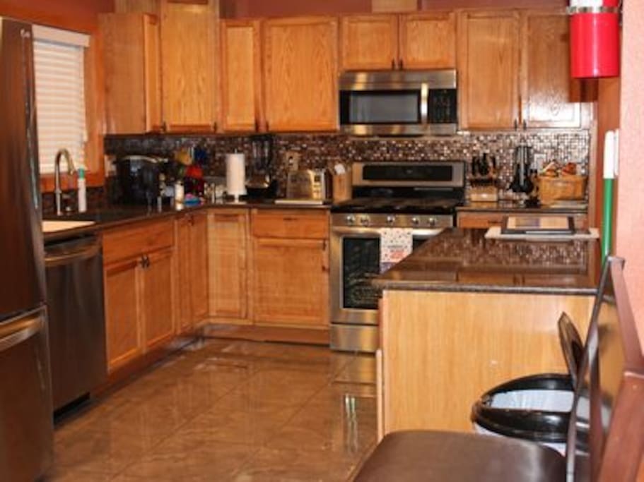 Beautiful kitchen with updated appliances and movable island