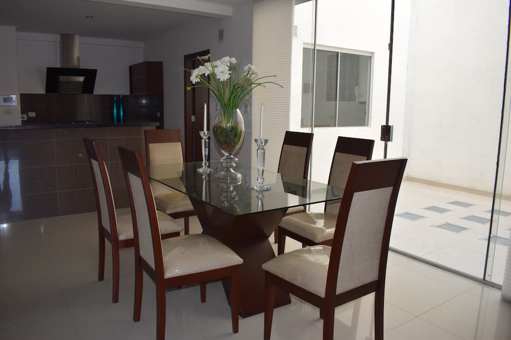 Dining area. On the immediate right-hand-side there is a small patio.