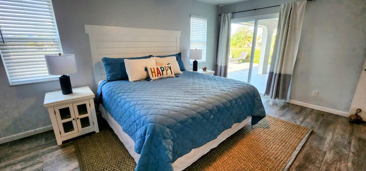 Stretch out and feel full relaxation in the most comfortable king size bed!  Enjoy the views from the large glass slider door with access right to the pool! 