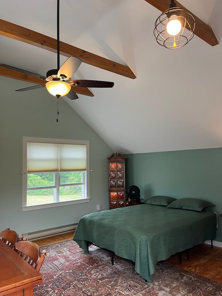 Spacious bright room with cathedral ceiling