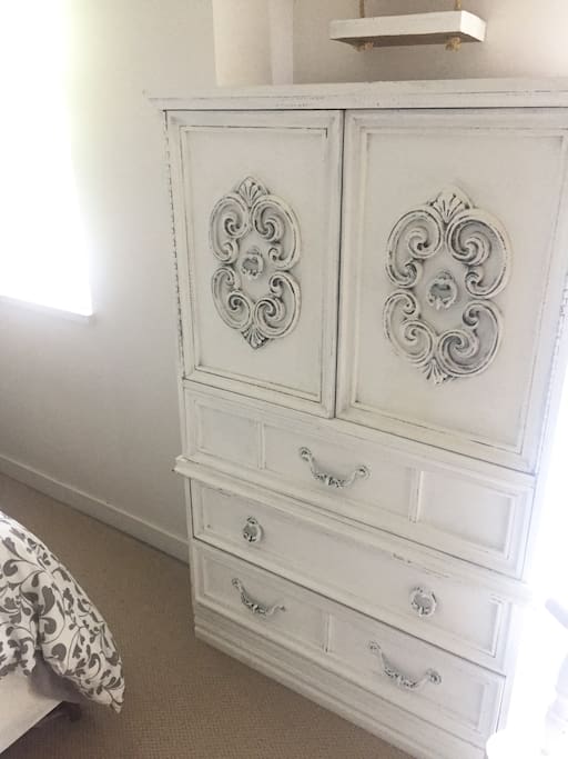 Cabinet has extra linens and towels for guest use