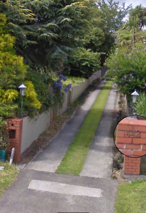 Red brick pillar driveway will lead to our home and inside we have plenty of parking space