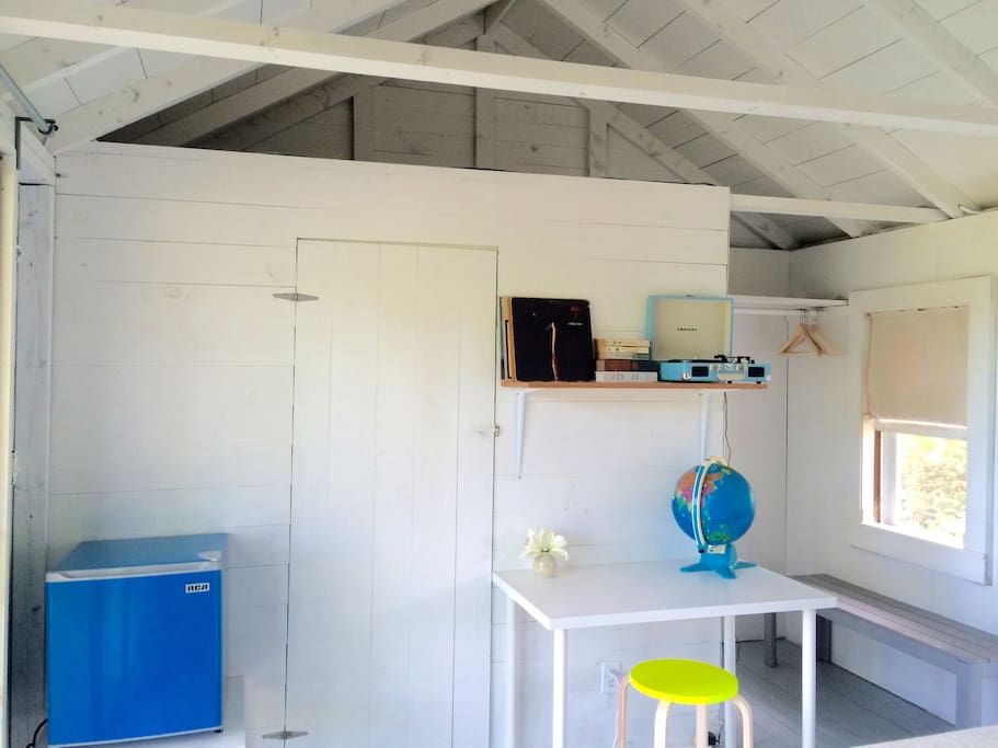 Each cabin has a mini fridge, record player and a globe.