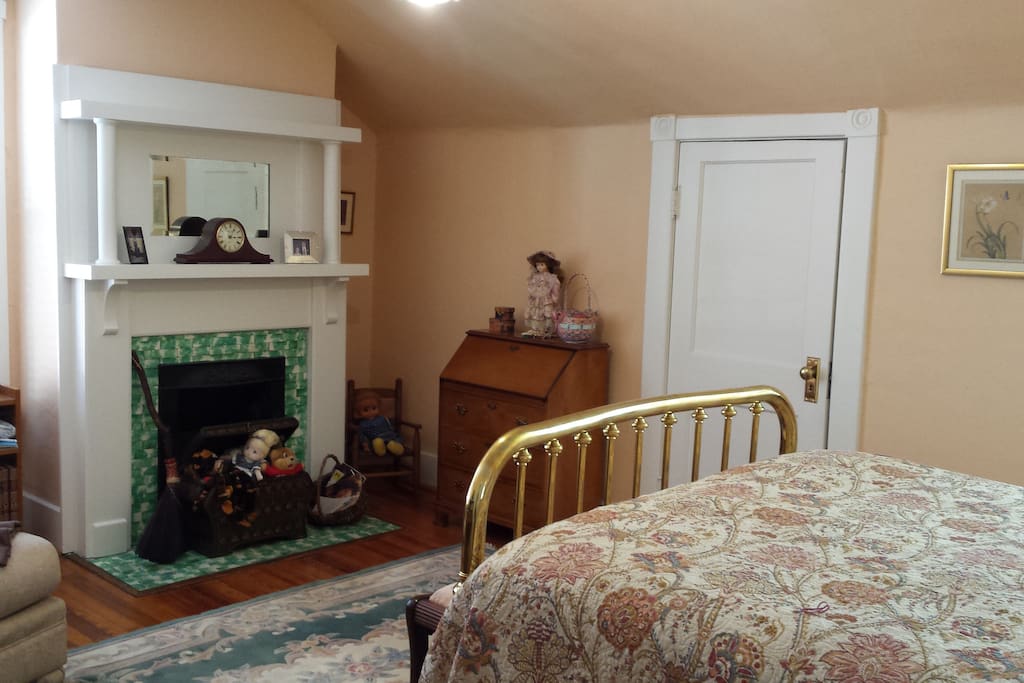 Antique brass bed with marble trim fireplace. Cable TV included