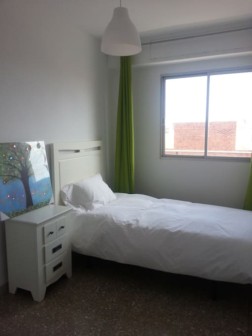 One on the three single bedrooms. New furniture. Sun in the morning.
