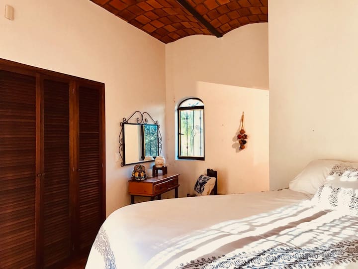 The enchanting master bedroom and full bath are located on the ground floor.