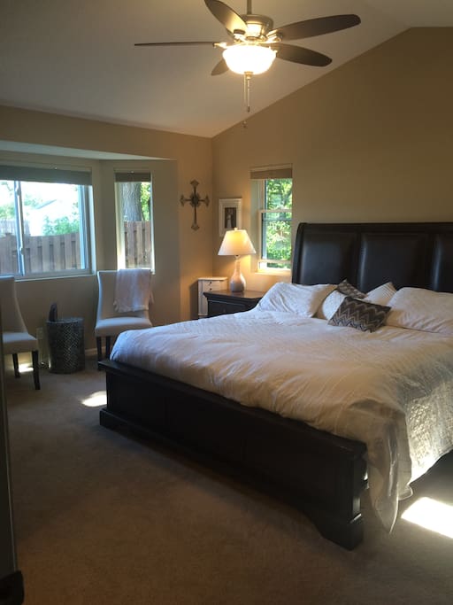 Master bedroom with vaulted ceilings and attached bath