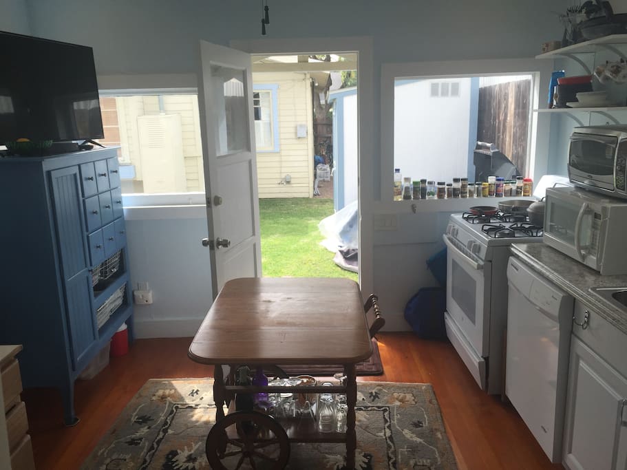 The dining room table folds out as needed. The living space is complete with hardwood flooring and wool area carpet.