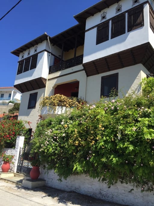 Traditional Pelion archontiko mansion in Trikeri, Greece. Beautiful gardens surround the home.
