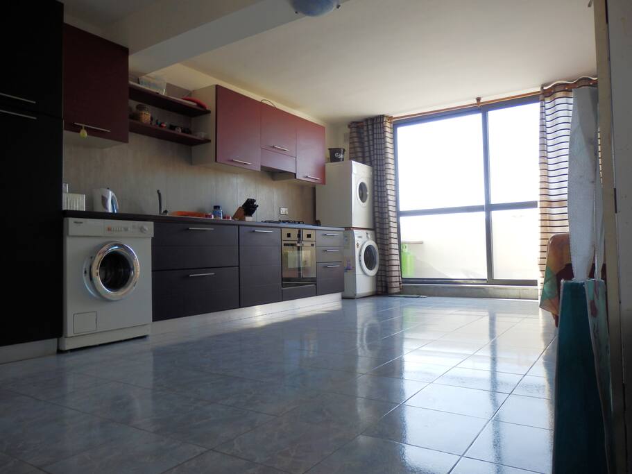 Kitchen, living room with a terrace enjoying seaviews.