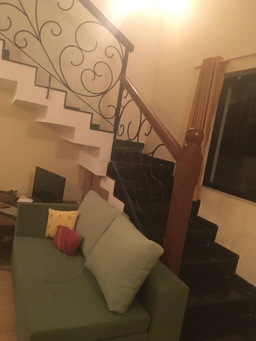Stairs from the living room to the upstairs bedroom