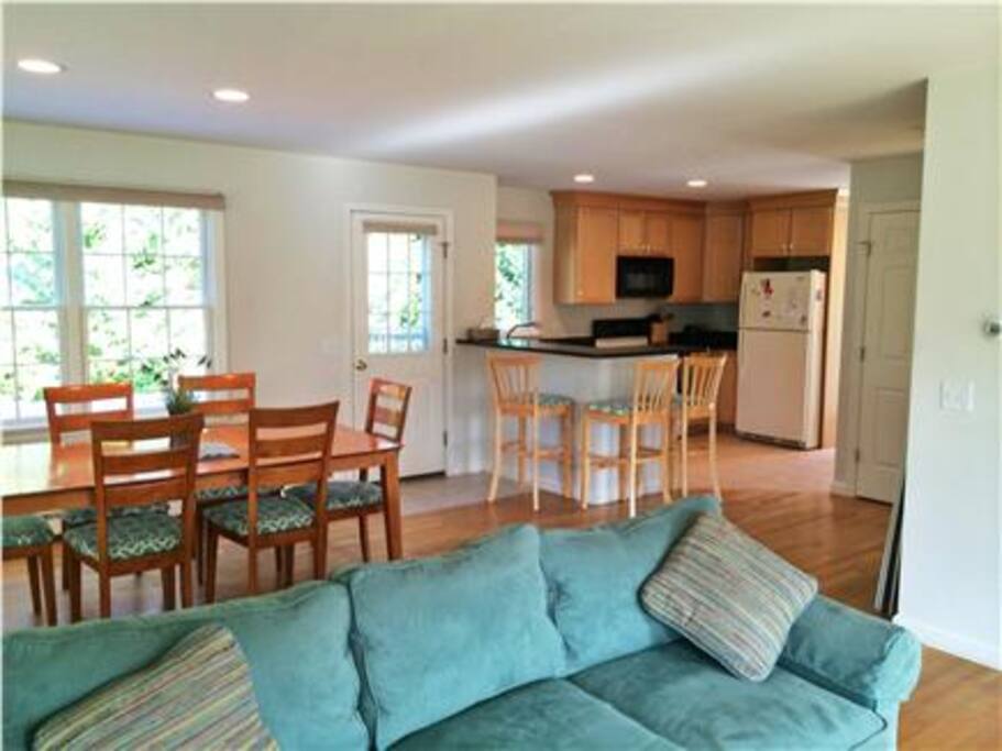 This home's first floor has an open design for the living room, dining room, kitchen and den area