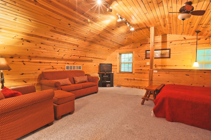 Loft area with TV couch and two queen beds
