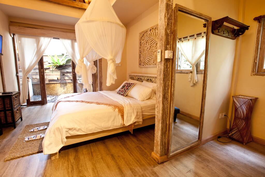 storage for cloth with full mirror beside the master bedroom .