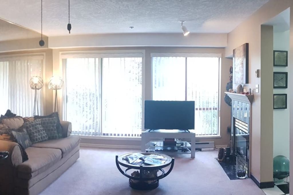 Living room, rearranged furniture and new tv! 9am and sunshine!