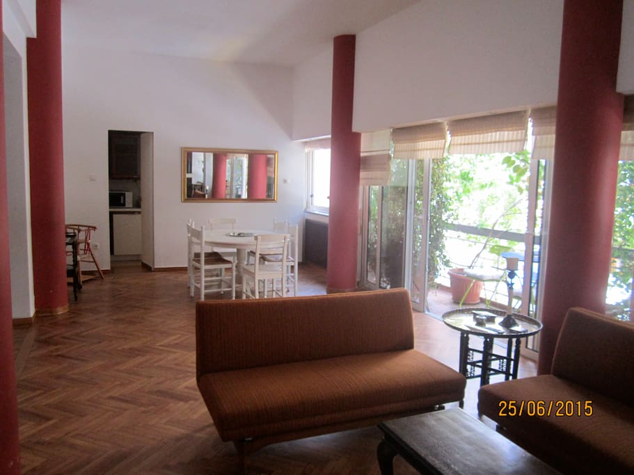Large sitting room with TV set, DVD set, fire place and long beautiful balcony.