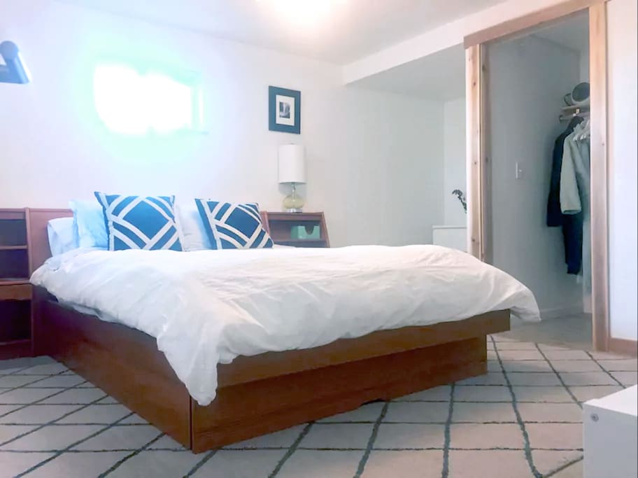 Master bedroom that gets ton of light with queen size bed and great linens.