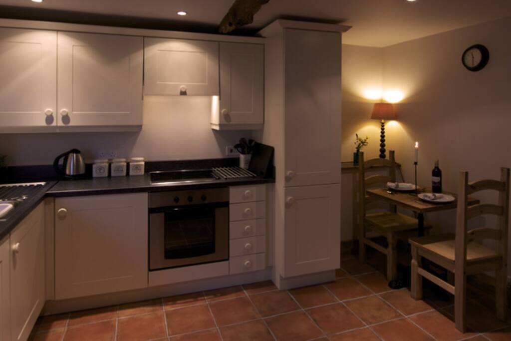 Kitchen complete with dishwasher, sink, oven and hob