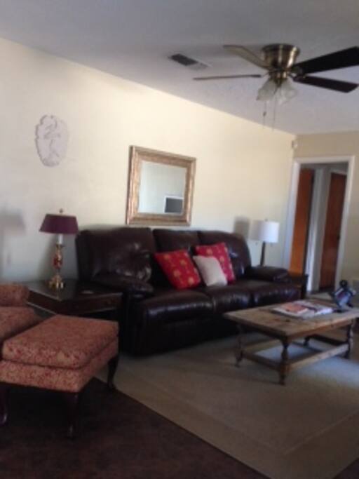 LIVING ROOM WITH LEATHER SOFA WITH RECLINING ENDS