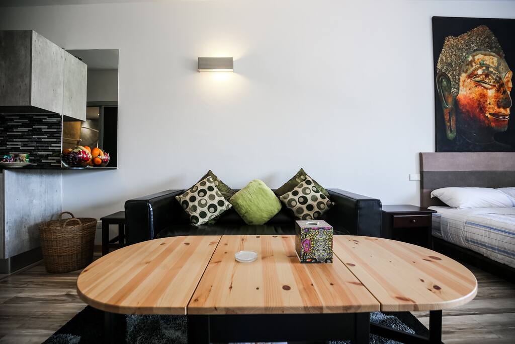 Large coffee table folds down on each end to allow more foot path