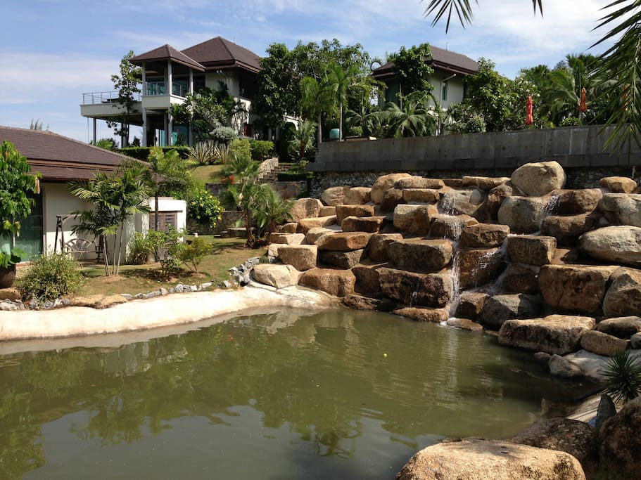 guest villa and waterfall with pond.