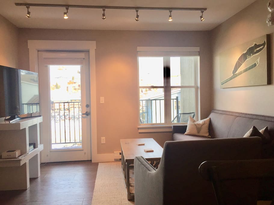 Living room with balcony view of the mountain