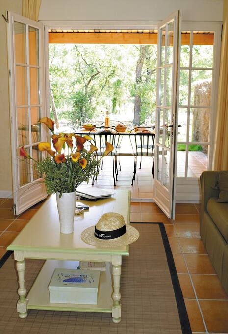 Large doors and floor-to-ceiling windows provide plenty of light to this home.